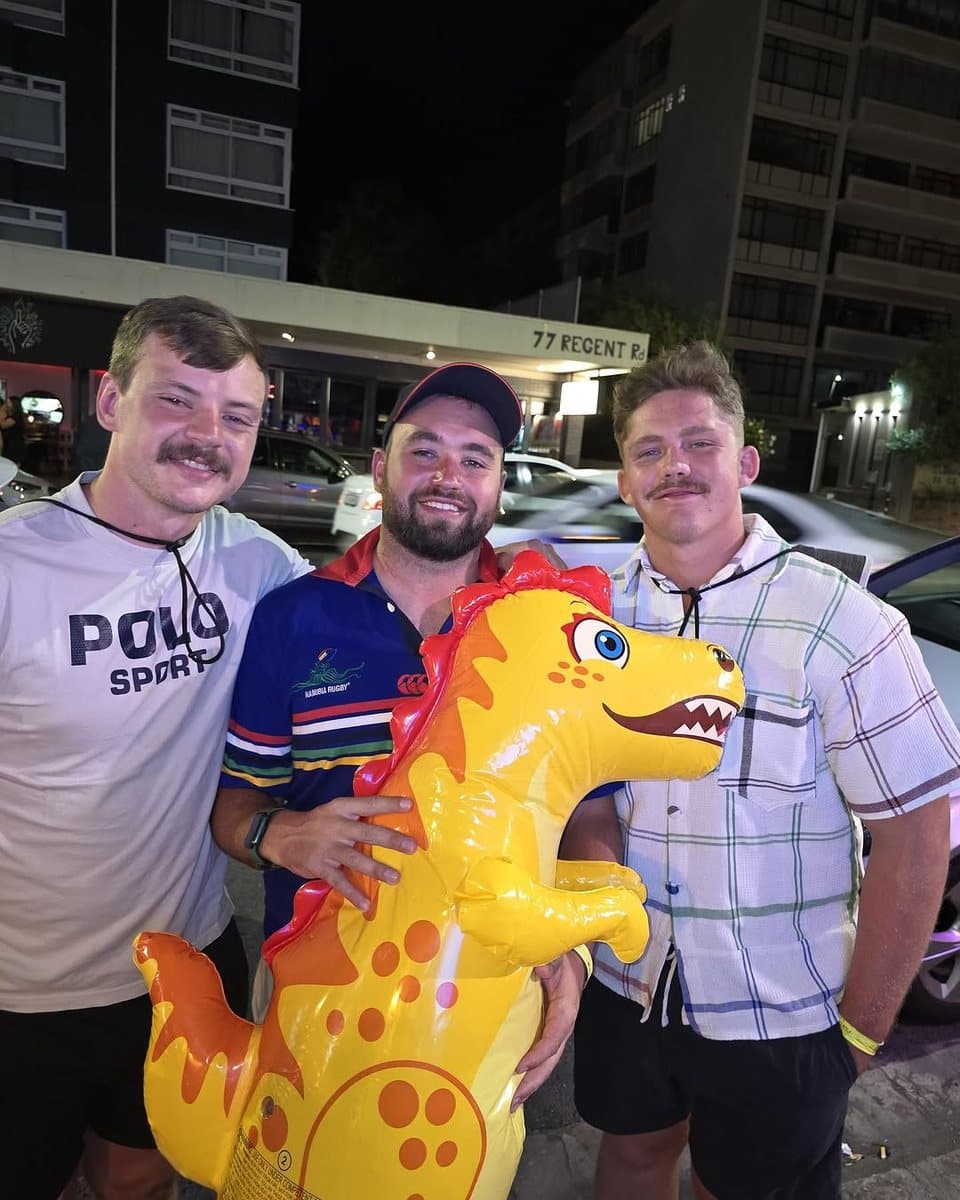 Three Raptors with moustaches and an inflatable dinosaur